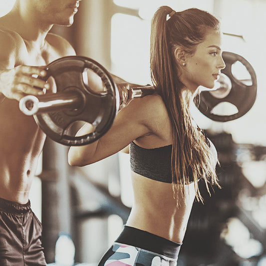 Women Squatting - Weight Training